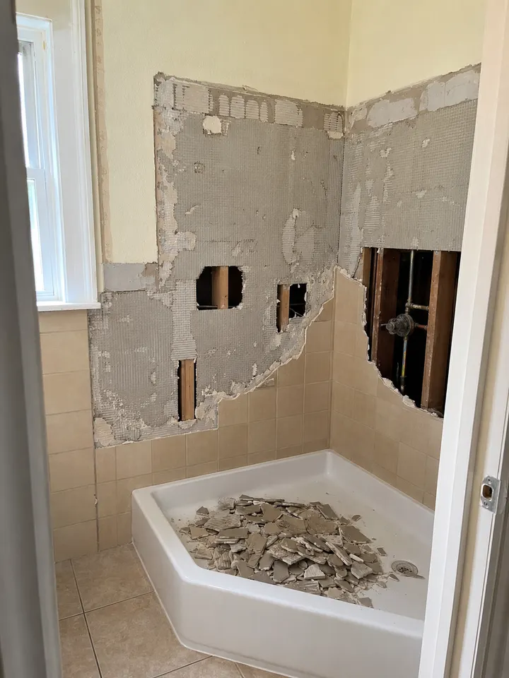 Bathroom shower wall opened during tile demolition